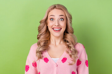 Wall Mural - Photo of astonished adorable girl with wavy hairdo dressed pink cardigan staring at discount open mouth isolated on green color background