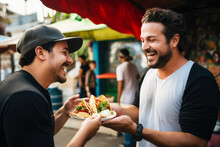 A Chef Gives A Taco To A Man At A Street Food Market