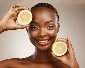 Sticker - Black woman, lemon fruits and portrait of beauty in studio for vitamin c, vegan cosmetics and facial on brown background. Face of happy model, citrus nutrition and sustainability for natural skincare