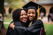 The jubilation of a successful graduation as a proud mother embraces her daughter, a black college graduate.