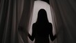 © kinomaster - Medium shot of a young woman's silhouette wrapped in a towel coming from behind the curtain, on a semi-transparent glowing background in a muffled light.