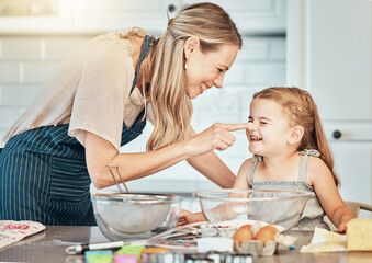 Wall Mural - Playful mother in kitchen, baking with kid and cooking fun, learning and nutrition with happy woman. Cookies, mom and girl children helping bake breakfast together in home with care, support and love