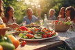 Group of people eating salad at outdoor on picnic together