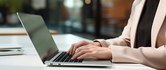 Wall Mural - woman is typing and using her laptop on table in office, in the style of contemporary minimalist, thin steel forms, light white and black, natural minimalism, polished surfaces. generative AI