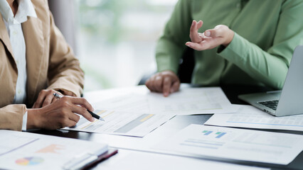 Business administrator calculates profit in a conference room..