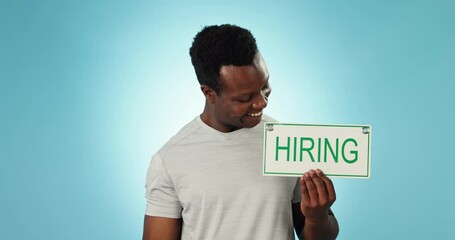 Canvas Print - Happy black man, dumbbell and hiring sign for gym, fitness or personal trainer against a blue background. Portrait of active African male person smile with billboard for recruiting and weightlifting