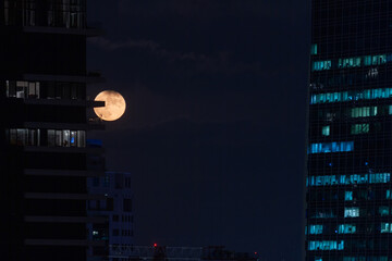 full moon in the morden city