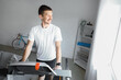 © Pixel-Shot - Sporty young man training on treadmill at home