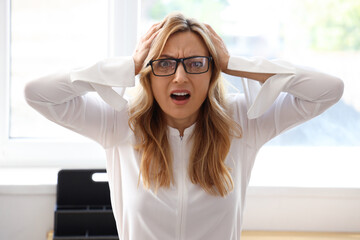 Poster - Scared mature businesswoman in office, closeup