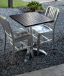 Silver Chrome Metal Chair Set with a Black Topped Table.