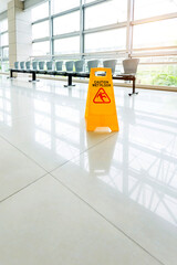 Wall Mural - Sign showing warning of wet floor