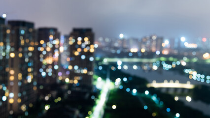 Canvas Print - Defocused blur of city buildings at night