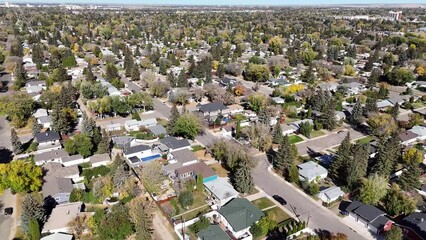 Wall Mural - Elevate your view over Adelaide Churchill, a historic neighborhood in Saskatoon, Saskatchewan. This aerial drone footage unveils tree-lined streets, character homes, and communal parks