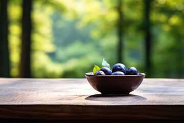 Poster - Bowl of fresh plums sitting on rustic wooden table. Perfect for food and nutrition-related content.