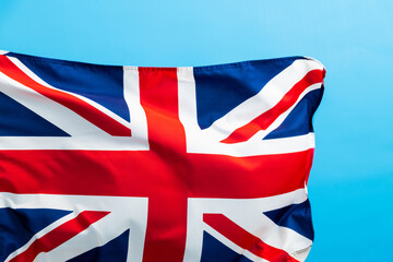 Wall Mural - British flag waving on blue background