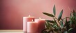 Handcrafted vegan candle in various forms pink color on a minimalistic background with natural materials Close up photo with whitespace area