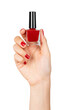 Female hand holding red nail polish on isolated background.