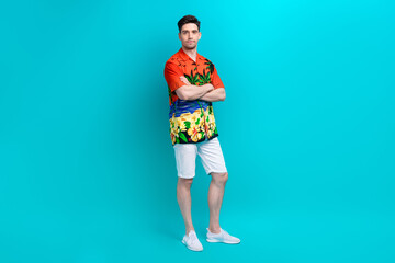 Poster - Full size photo of satisfied serious nice guy wear tropical shirt stylish shorts holding arms folded isolated on blue color background