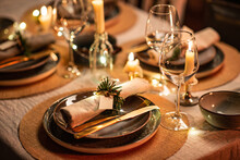 Winter Holidays, Dinner Party And Celebration Concept - Close Up Of Scandinavian Christmas Table Serving With Burning Candles At Home At Night