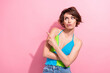 Photo of unsure uncertain lady wear green blue tank looking showing finger empty space isolated pink color background