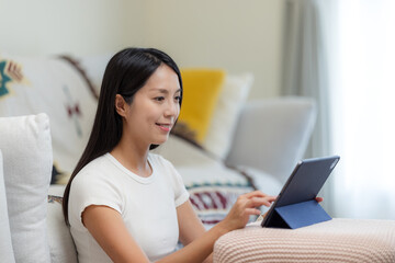 Wall Mural - Woman use of digital tablet at home