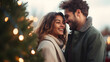 © Prasanth - Closeup photo of cute couple spending holly Christmas eve in decorated garland lights house near Chrismas tree outdoors