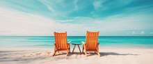 Beach Chairs On Tropical Sandy Beach With Turquoise Ocean Water