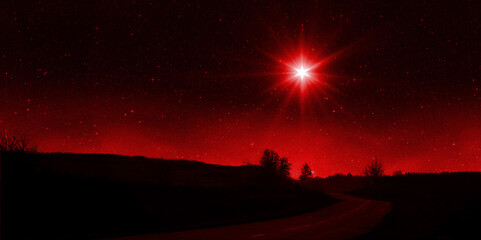 Canvas Print - Bright red star shines over the road at night. Birth of Jesus concept, Star of Bethlehem