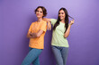 © deagreez - Photo of funky flirty girls dressed t-shirts smiling holding hair curl isolated purple color background