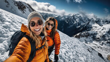 Two Young Women Friends Smiling In Mountains While Hiking And Taking A Selfie