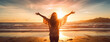 © MD Media - Successful woman with arms up on the beach with his arms up showing the ocean raising hands to the sky.