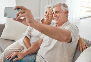 Poster - Happy, old couple and selfie on sofa in home, living room or apartment in retirement with post on social media. Mature, people and smile in profile picture, live stream or video call with smartphone