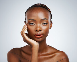 Wall Mural - Portrait of black woman, natural beauty or glow with wellness in studio with an aesthetic shine. Dermatology, clean face or confident African girl model with skincare results on white background