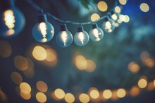 Holiday Illumination And Decoration Concept - Christmas Garland Bokeh Lights Over Blue Shaded Background Banner, Stars, Baubles And Decoration For X-mas