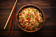 Chinese fried rice in a bowl with vegetables and spices. Asian food. Top view