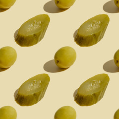 Wall Mural - Seamless pattern with pickled cucumber and olive on beige background.