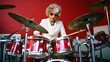 © czfphoto - Elderly Musician Shares Drumming Talents with a Beaming Smile