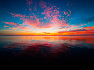 Wall Mural - Sunset on the beach with clouds