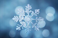 Close-up Image Of A Symmetric Filigrane Snow Flake. Winter Background. 