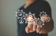© THAWEERAT - New product development or software development concept. Using AI in the design process. Businessman pointing to R and D cog research and development and gear icons as a continuous process automation.