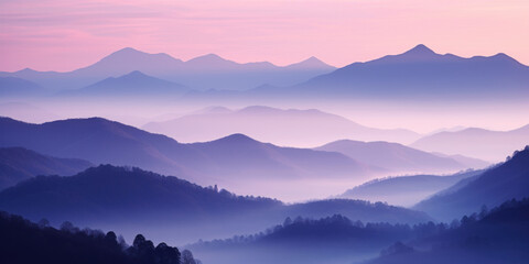 Canvas Print - The mountains are shrouded in mist, and the last traces of daylight lend a tranquil, mystical quality to the scene. A twilight shot of autumn mountains under a fading pink and purple sky.