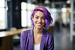 portrait of smiling young woman with short dyed ombre purple hair in office	