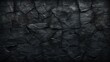 Background with a distressed rough black fractured wall with a slate texture rough backdrop, dark floor, or vintage grunge backdrop