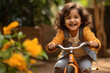 Cute indian little girl child riding bicycle