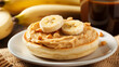 A peanut butter banana English muffin: warm and toasty with creamy peanut butter and slices of ripe banana, a comforting, sweet and nutty delight.