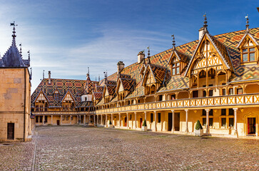 The Hospices de Beaune or Hôtel-Dieu de Beaune is a former charitable almshouse in Beaune, France