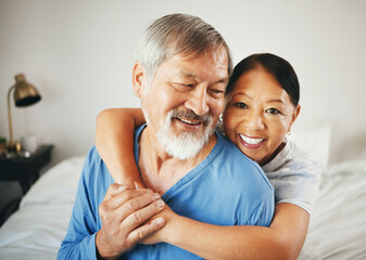Wall Mural - Happy senior couple, hug and love in bedroom for marriage, relationship or care together at home. Mature woman hugging man with smile in happiness for embrace, support or trust on bed in retirement