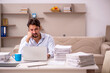 © Elnur - Young businessman employee working from home during pandemic
