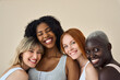 © insta_photos - Happy positive diverse women, four smiling multicultural beauty faces international models girls group in lingerie underwear bras hugging bonding standing isolated on beige background, portrait.