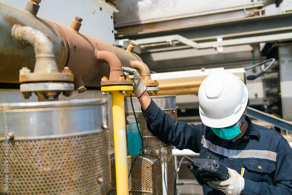 Non-destructive testing technicians are checking the thickness of elbow ...